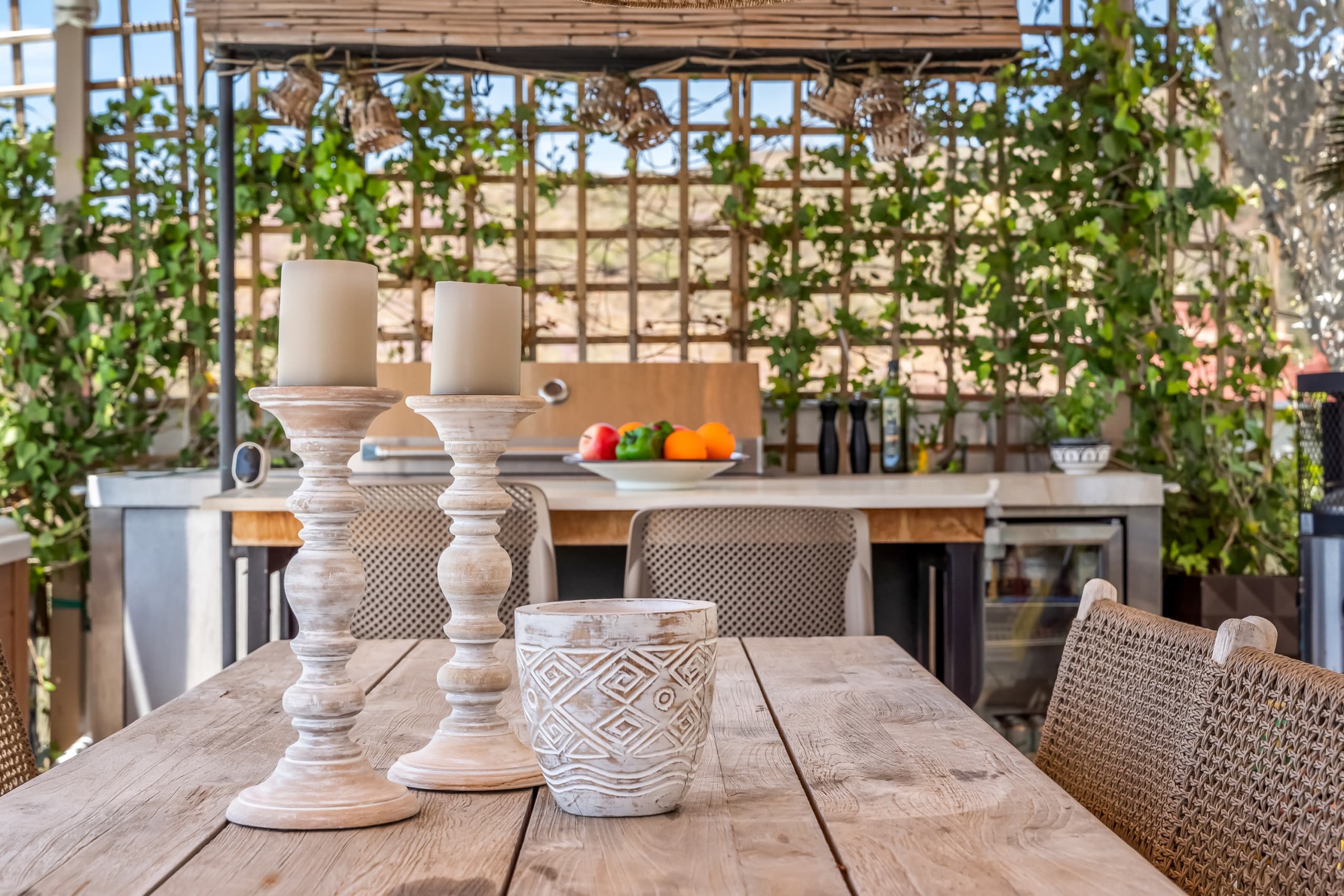 Outdoor kitchen detail with candles and fresh fruit